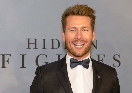 When John Stamos applies makeup, Glen Powell smiles the most charmingly and widely.